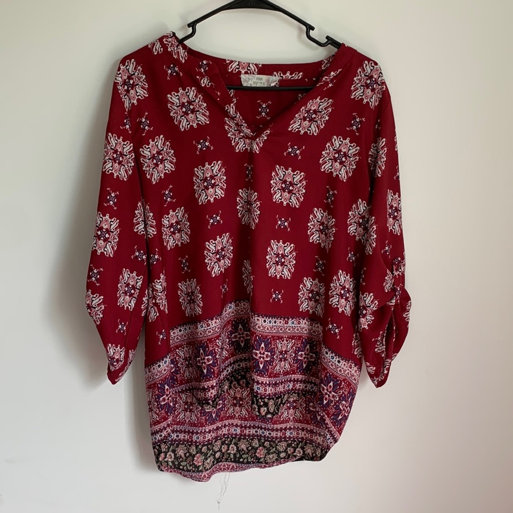 Red with blue and white pattern blouse